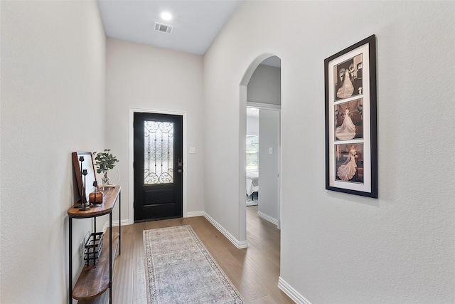 entrance foyer with hardwood / wood-style floors