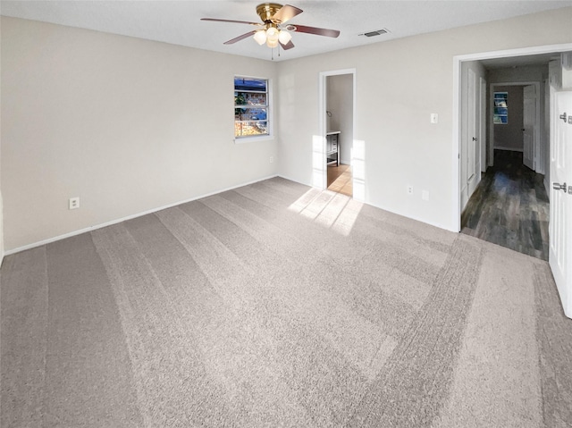 unfurnished room featuring carpet flooring and ceiling fan