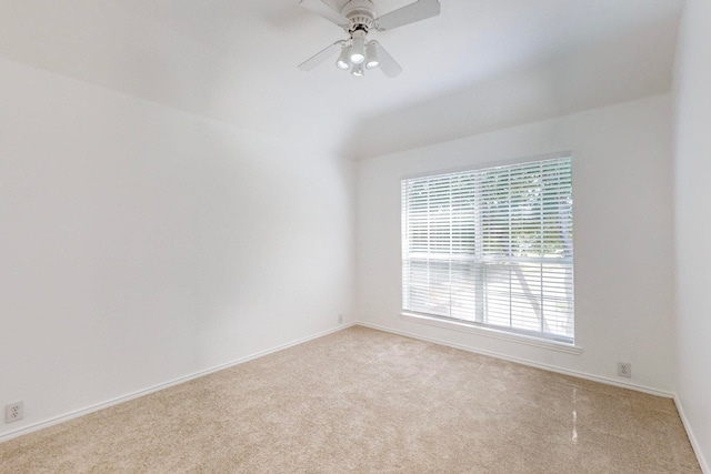 empty room featuring light carpet and ceiling fan