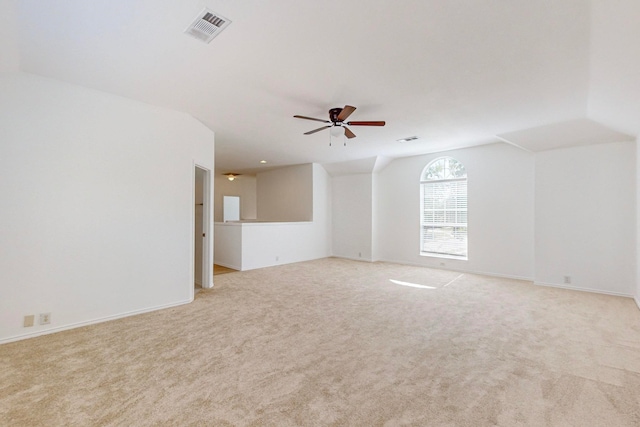 interior space featuring light carpet and ceiling fan