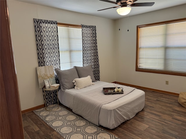 bedroom featuring dark wood-type flooring and ceiling fan