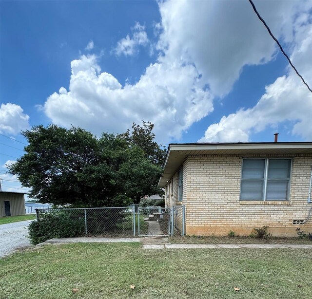 view of property exterior with a lawn