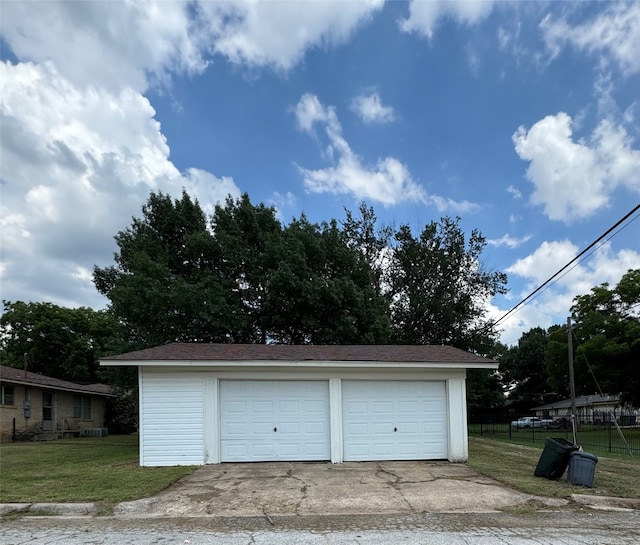 garage featuring a yard