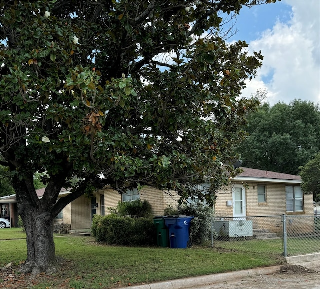 view of property exterior with a lawn