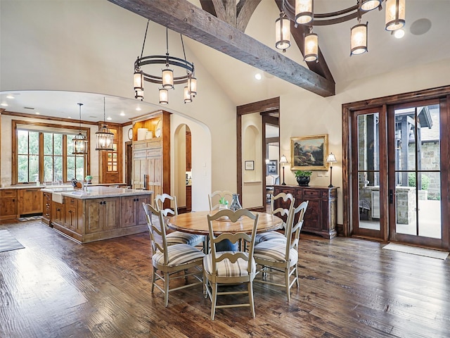 dining room with beam ceiling, high vaulted ceiling, and dark hardwood / wood-style floors