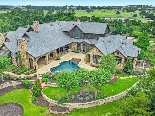 view of pool featuring a patio area and a yard