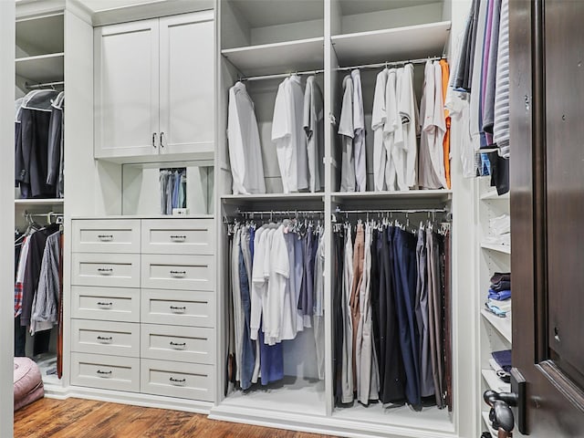 spacious closet featuring hardwood / wood-style floors