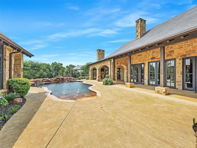 view of pool featuring a patio