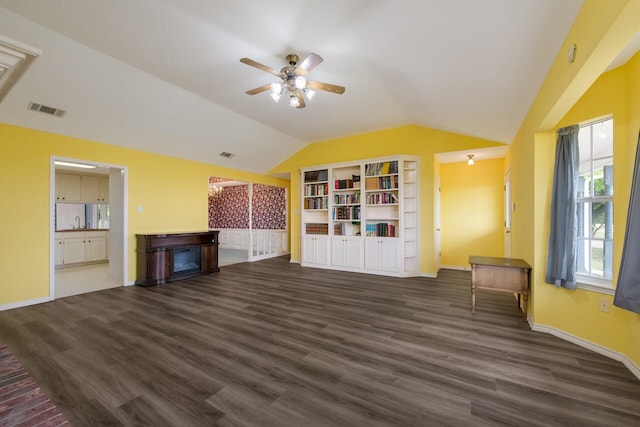 unfurnished living room featuring lofted ceiling, sink, dark wood-type flooring, and ceiling fan