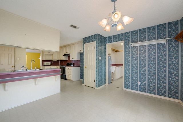 kitchen featuring water heater, sink, electric range, and light tile floors