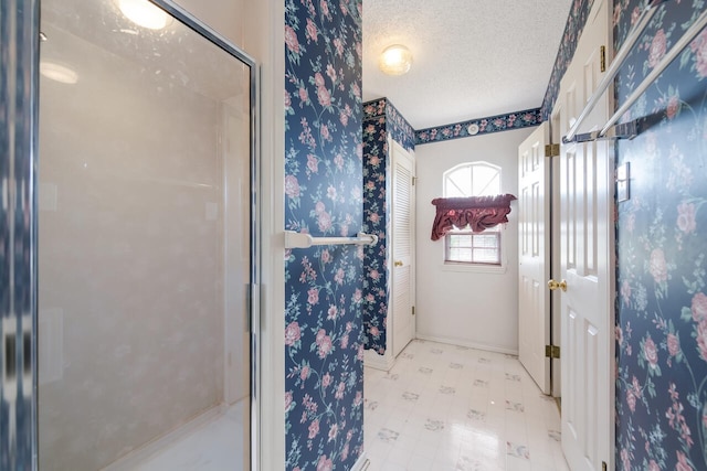 bathroom featuring tile floors and a textured ceiling