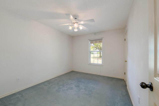 empty room featuring carpet and ceiling fan