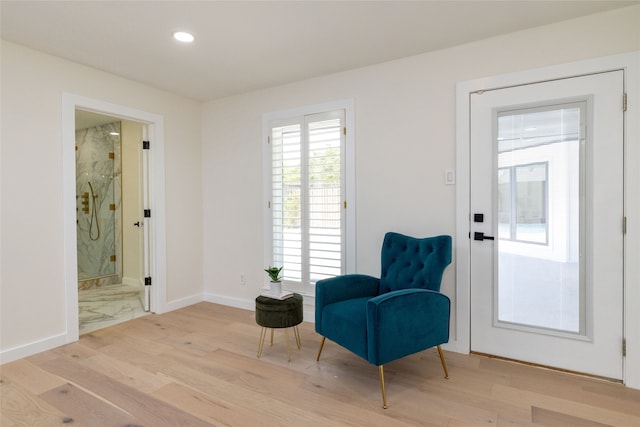 sitting room with light wood-type flooring