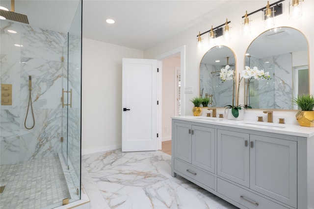 bathroom featuring a tile shower and vanity