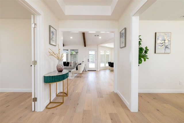 corridor with light wood-style flooring, recessed lighting, beam ceiling, and baseboards