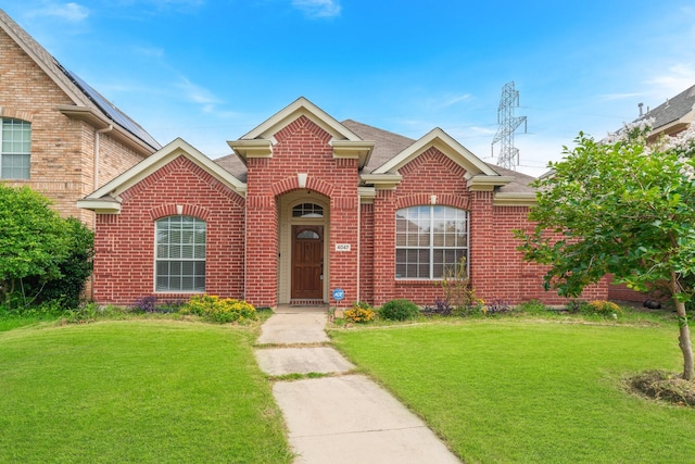 front facade with a front yard