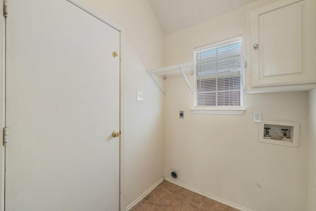 clothes washing area with hookup for a washing machine, light tile patterned floors, cabinets, and hookup for an electric dryer