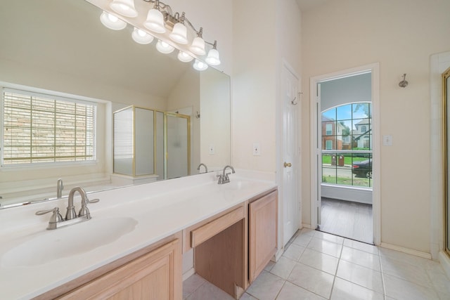 bathroom featuring walk in shower, tile patterned floors, and a wealth of natural light