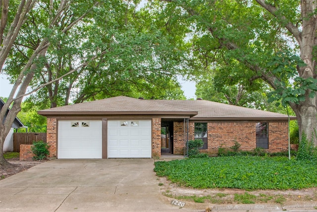 ranch-style home featuring a garage