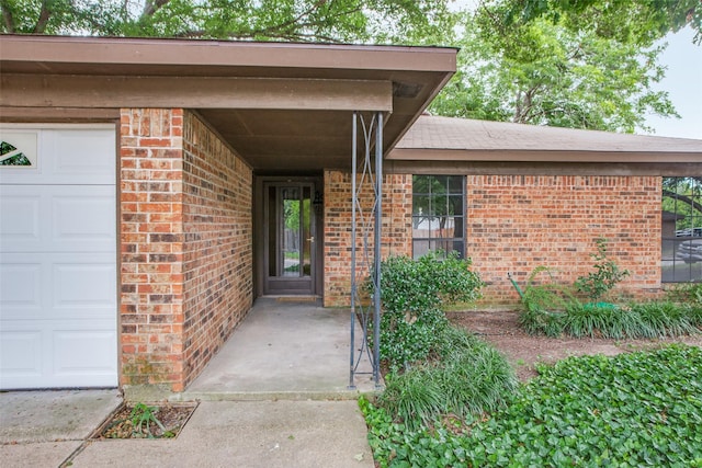 doorway to property featuring a garage