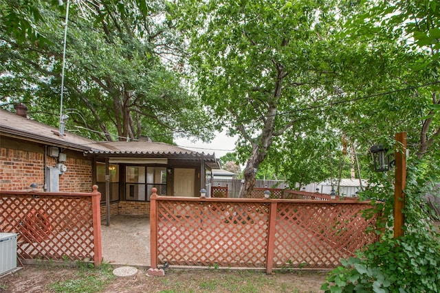 view of gate featuring central AC unit