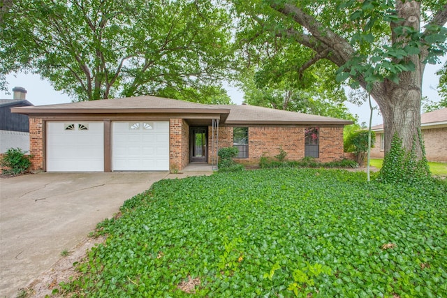 single story home featuring a garage