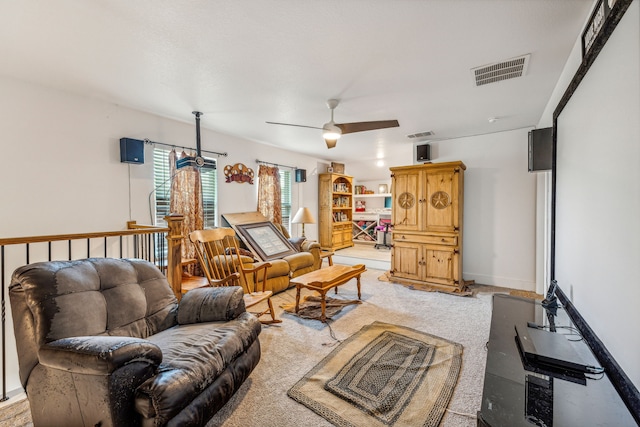 living room featuring carpet floors and ceiling fan