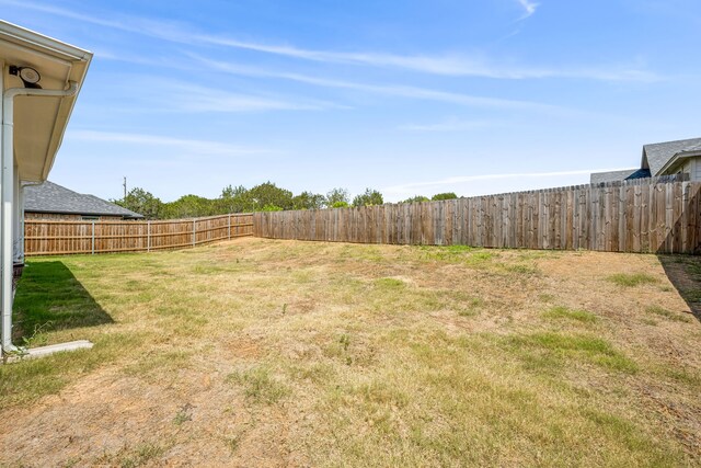 back of house with a yard and a patio area