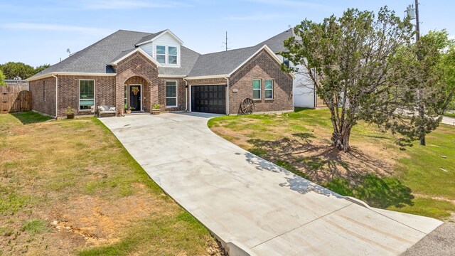 view of front facade with a garage and a front yard