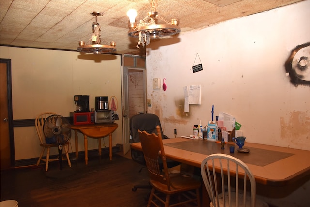 dining room with an inviting chandelier and hardwood / wood-style flooring