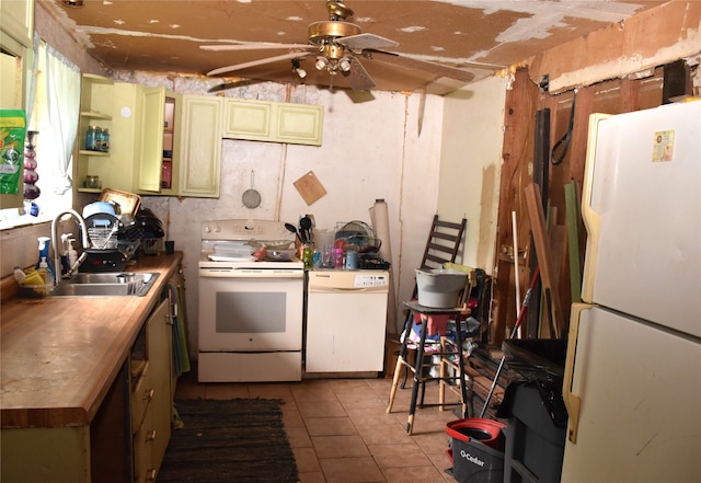 kitchen featuring sink, white appliances, ceiling fan, and light tile patterned floors