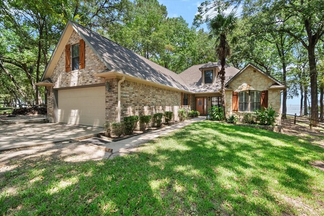 view of front facade with a front lawn and a garage