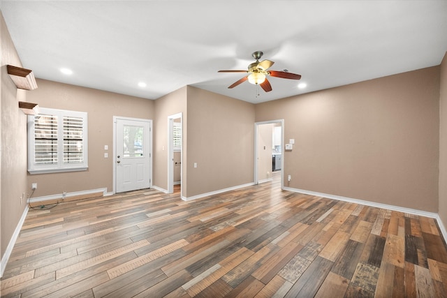 entryway featuring ceiling fan and wood-type flooring