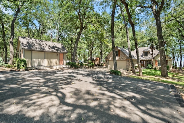 view of front of property with a front lawn and a garage