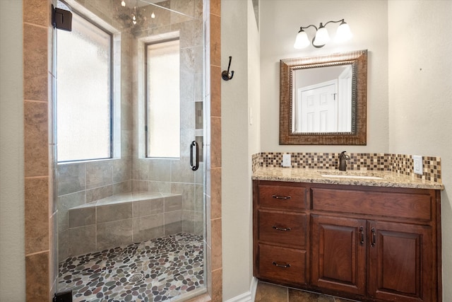 bathroom with tile patterned flooring, shower with separate bathtub, vanity, and backsplash