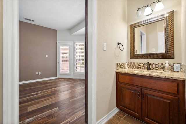 bathroom featuring vanity and wood-type flooring