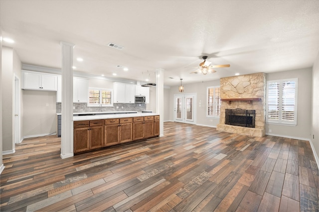 kitchen featuring white cabinetry, dark hardwood / wood-style floors, and tasteful backsplash