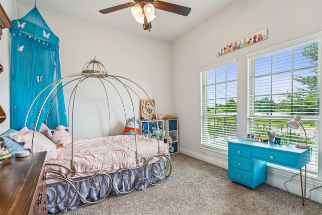 carpeted bedroom with multiple windows and ceiling fan