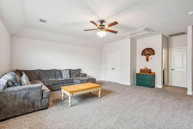 carpeted living room with ceiling fan and vaulted ceiling