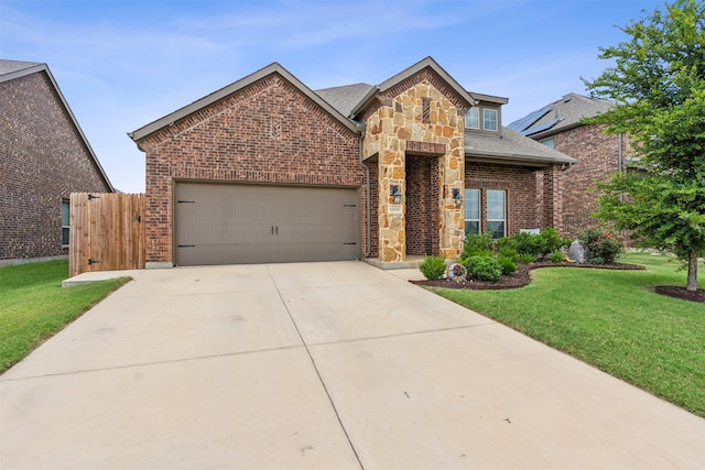 view of front of home featuring a garage and a front lawn