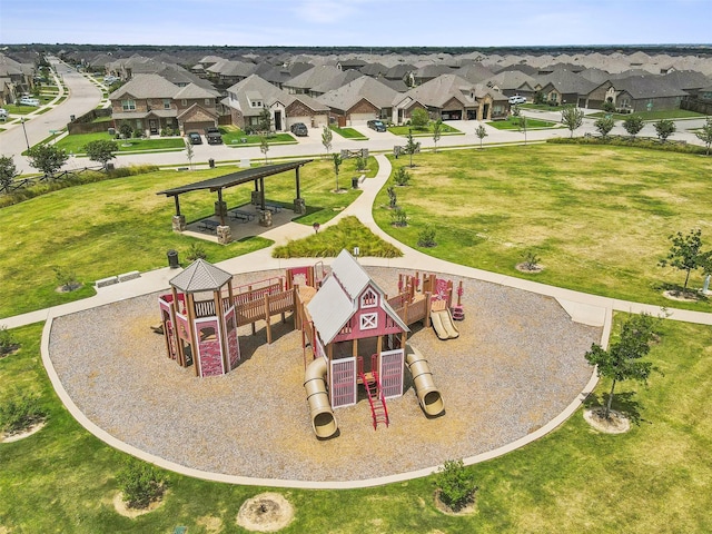 view of community featuring a lawn and a playground