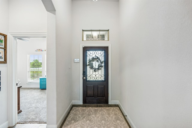 foyer with light carpet