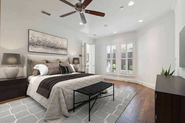 bedroom with hardwood / wood-style flooring, crown molding, and ceiling fan