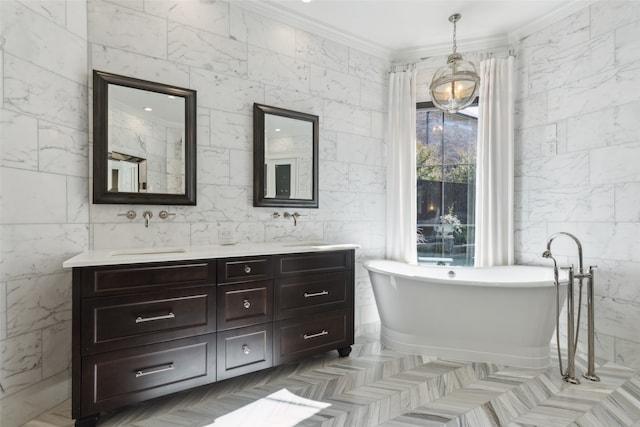 bathroom featuring a bathing tub, tile walls, vanity, and crown molding