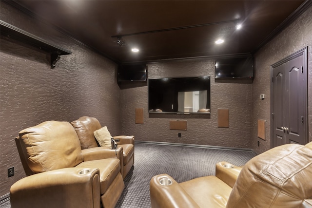 home theater featuring ornamental molding and carpet flooring