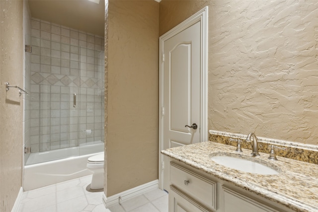 full bathroom featuring tile patterned flooring, vanity, toilet, and tiled shower / bath combo