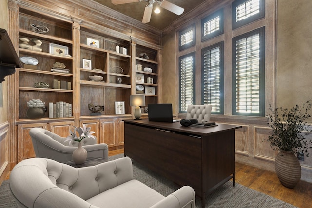 office space with hardwood / wood-style floors, built in features, ornamental molding, and ceiling fan