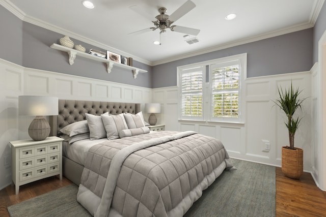 bedroom featuring ceiling fan, dark hardwood / wood-style flooring, and ornamental molding