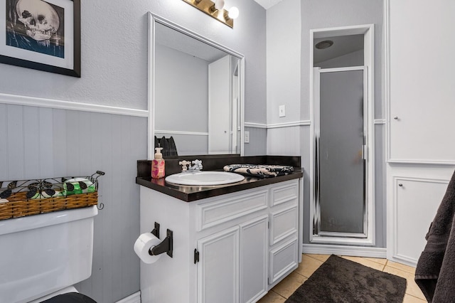 1302 E Franklin St, Hillsboro, TX 76645 - bathroom with vanity, tile patterned flooring, a shower with door, and toilet