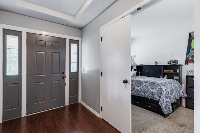 1302 E Franklin St, Hillsboro, TX 76645 - foyer entrance featuring hardwood / wood-style flooring and a textured ceiling